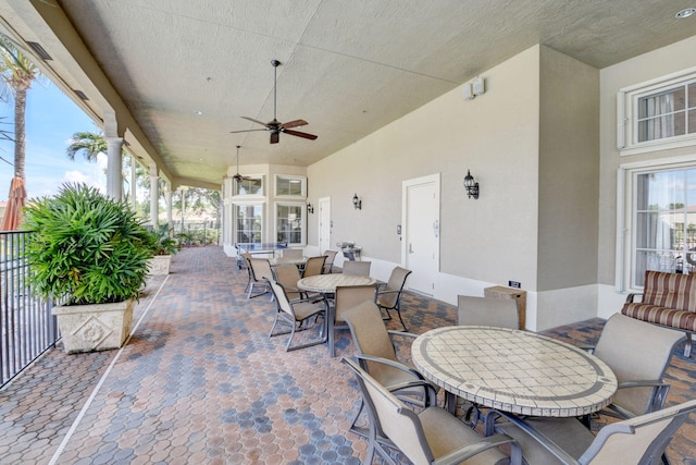 view of patio featuring ceiling fan