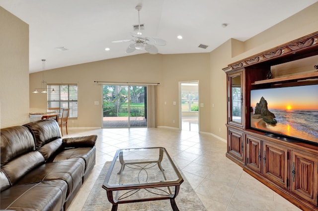 living room with vaulted ceiling, ceiling fan, and light tile floors