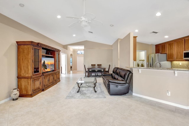 tiled living room featuring lofted ceiling and ceiling fan