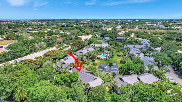 birds eye view of property with a water view and a residential view