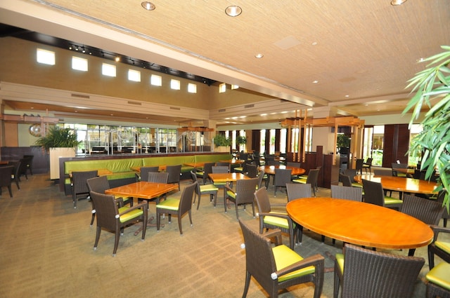 dining space with carpet and recessed lighting