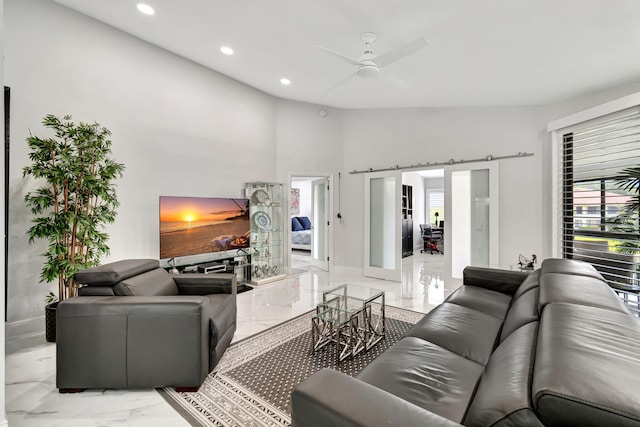 tiled living room featuring a healthy amount of sunlight, vaulted ceiling, and ceiling fan