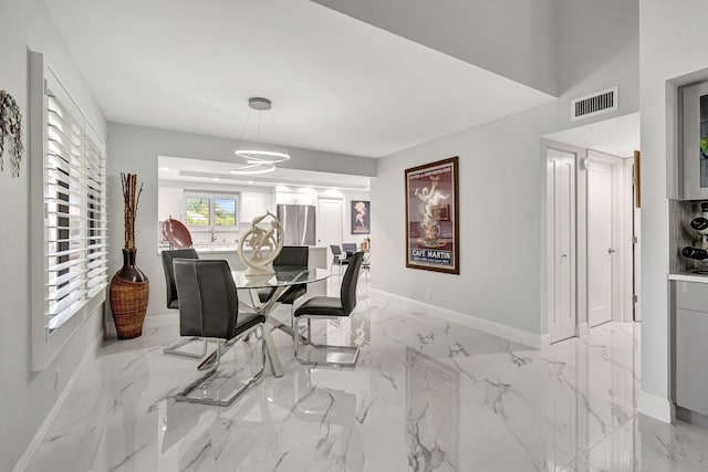 dining room with light tile floors