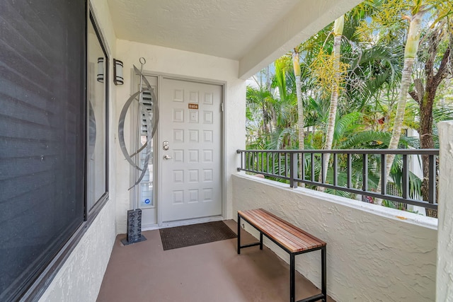 doorway to property with a balcony