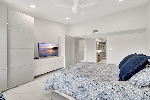 bedroom with ceiling fan and ensuite bathroom