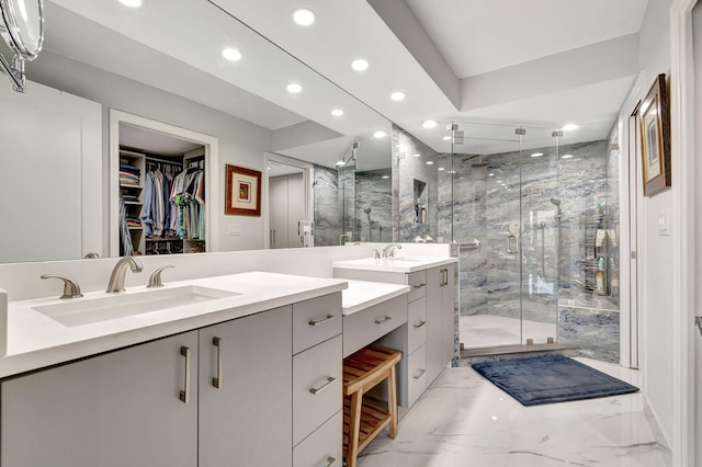 bathroom with tile flooring, a shower with door, and dual bowl vanity