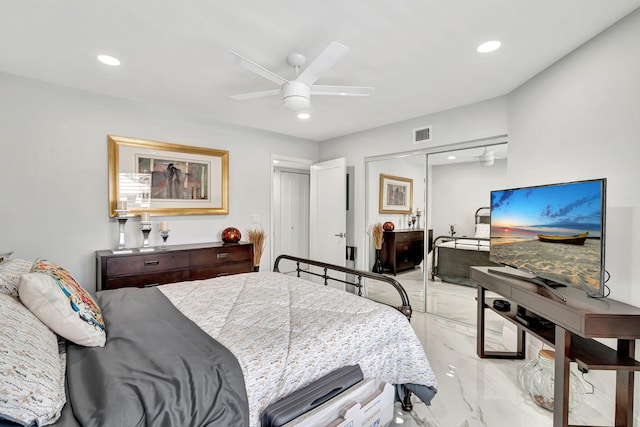 bedroom with ceiling fan, a closet, and light tile flooring