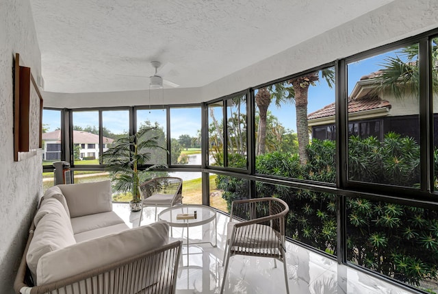 sunroom featuring ceiling fan