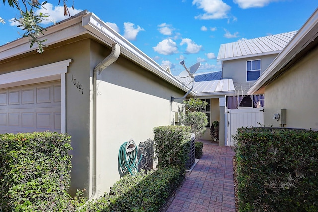 view of side of property featuring a garage