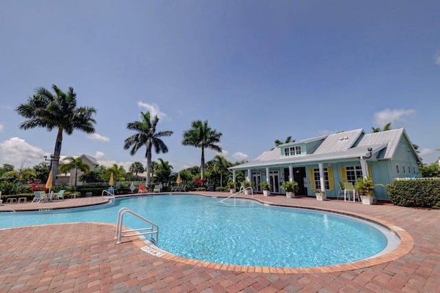 view of swimming pool with a patio