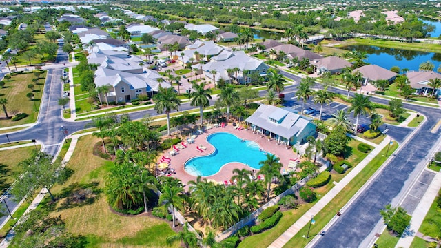 birds eye view of property with a water view