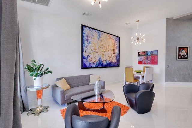 living room with a chandelier and light tile patterned floors