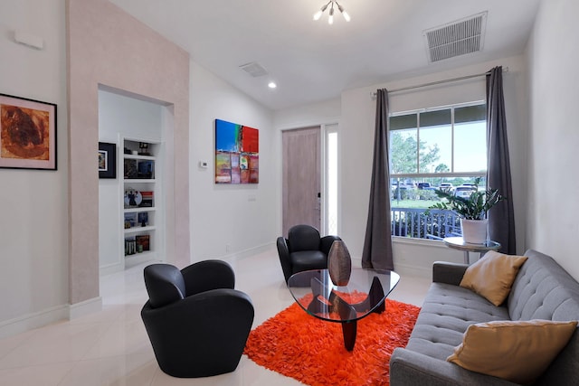 tiled living room featuring built in features and vaulted ceiling