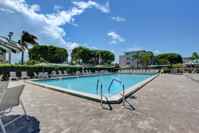 view of swimming pool with a patio area