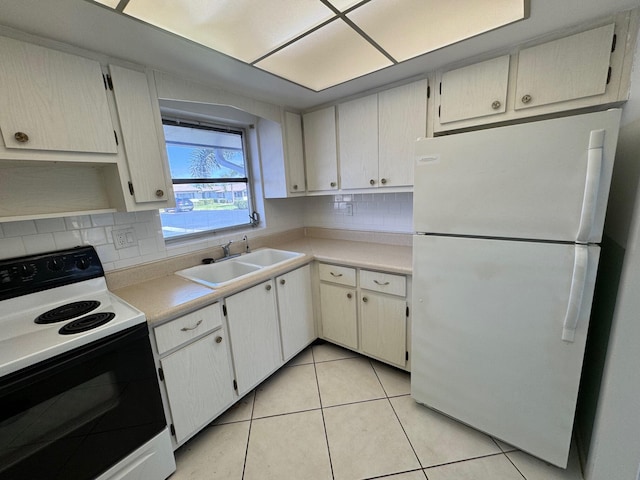 kitchen with backsplash, sink, white appliances, and light tile floors