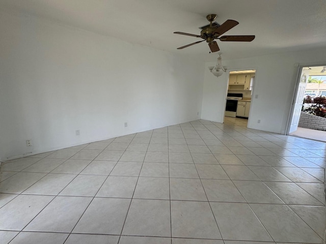 interior space featuring ceiling fan and light tile floors