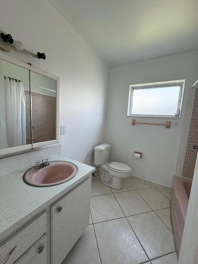 full bathroom with tile flooring, vanity, toilet, and shower / tub combo