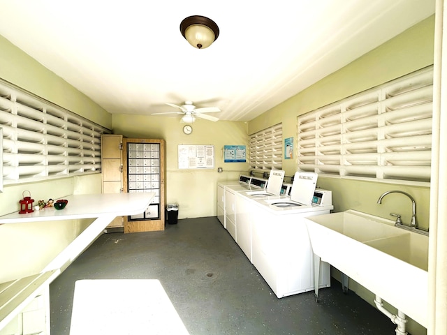 laundry area with independent washer and dryer, sink, and ceiling fan