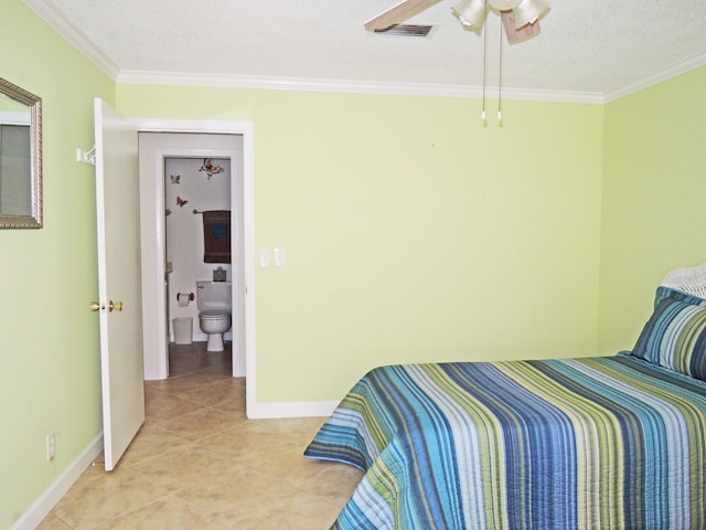 tiled bedroom with ensuite bathroom, ceiling fan, and ornamental molding