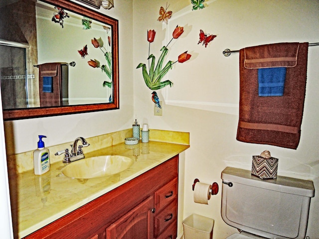 bathroom with toilet and vanity