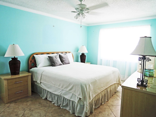 tiled bedroom featuring ceiling fan, multiple windows, crown molding, and a textured ceiling