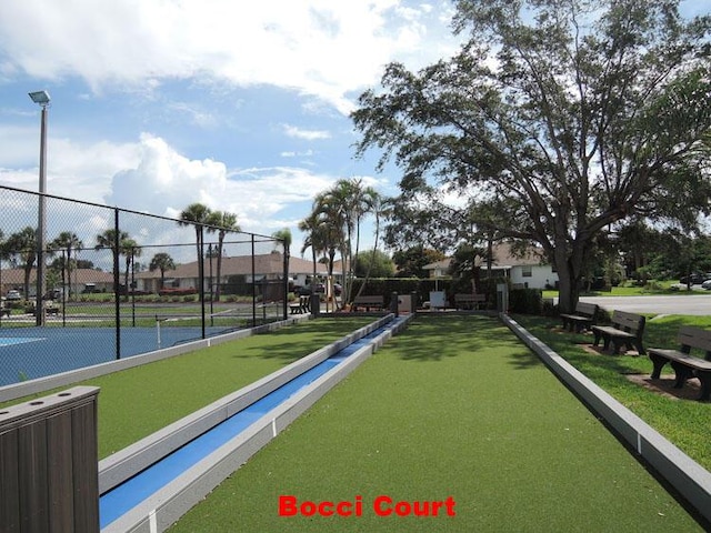 surrounding community featuring tennis court