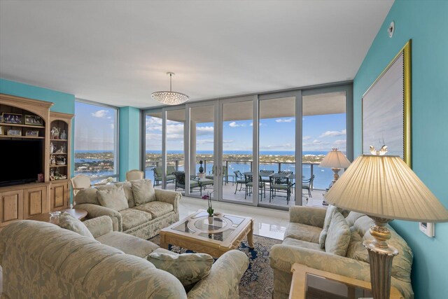 living room featuring a water view and floor to ceiling windows