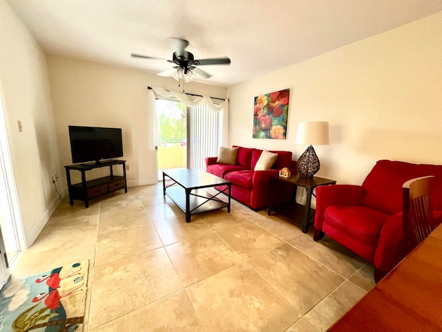 living room featuring ceiling fan and tile floors