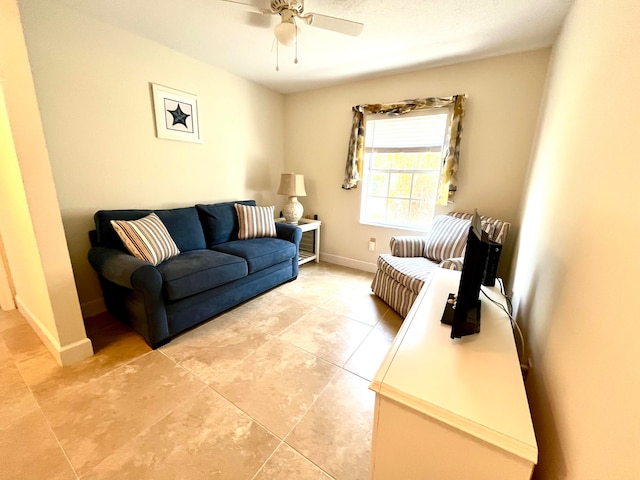 living room with ceiling fan and light tile floors