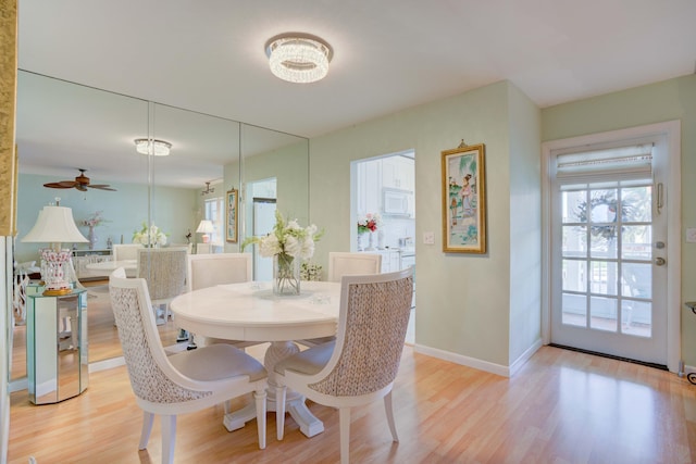 dining room featuring light wood-type flooring and ceiling fan