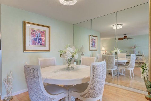 dining room featuring ceiling fan and light wood-type flooring