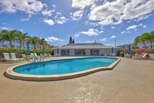 view of swimming pool featuring a patio