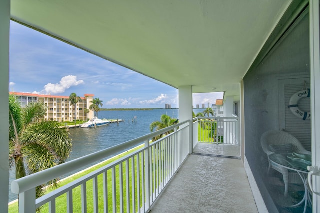 balcony featuring a water view