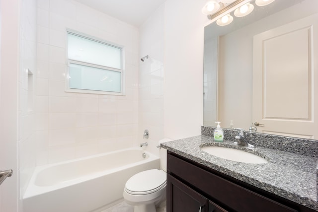 full bathroom featuring vanity, toilet, and tiled shower / bath