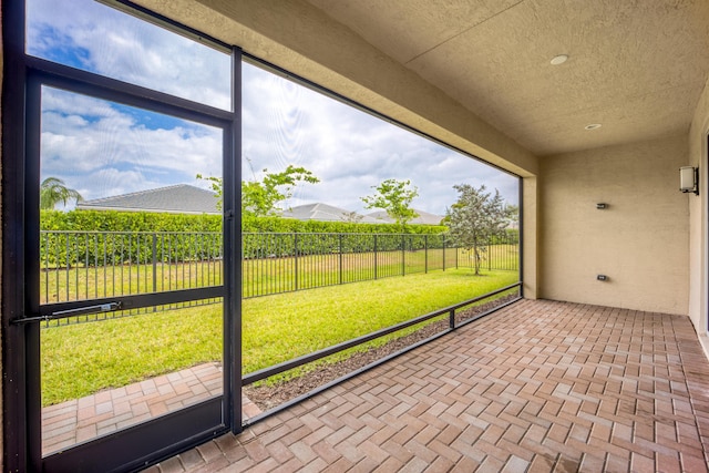 unfurnished sunroom with a healthy amount of sunlight