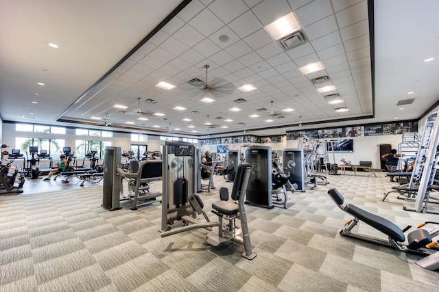 workout area with light carpet and ceiling fan