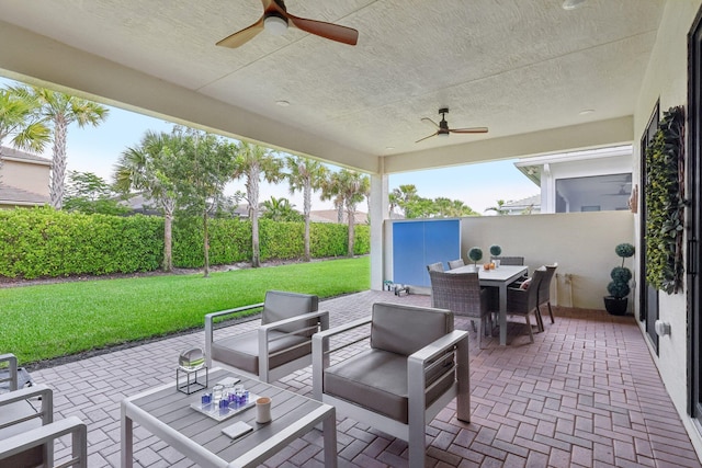 view of patio / terrace with ceiling fan and an outdoor hangout area