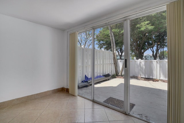 doorway featuring light tile floors