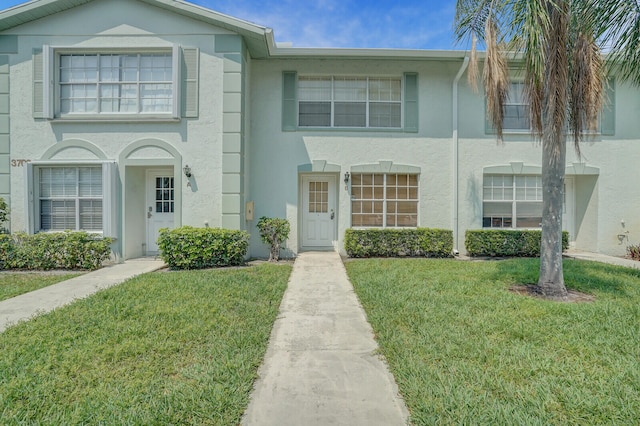 view of front of house with a front lawn