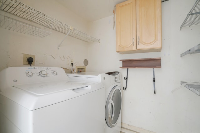 laundry room with washer and dryer, cabinets, washer hookup, and hookup for an electric dryer