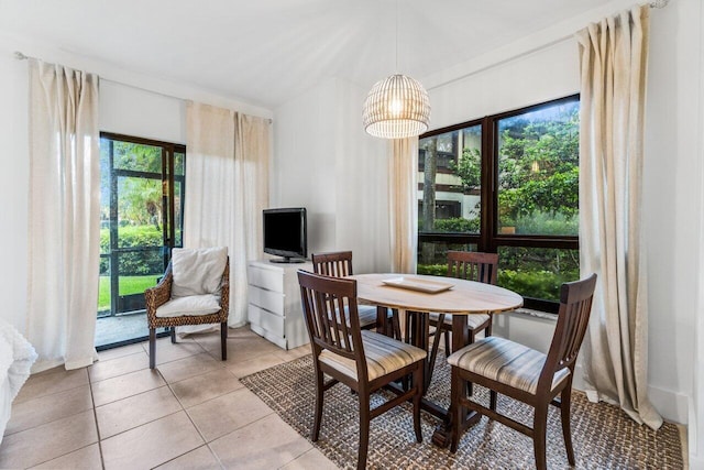 dining area featuring light tile patterned floors