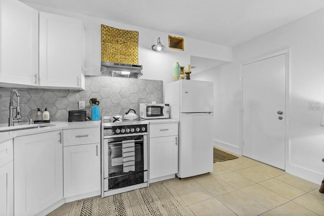 kitchen featuring sink, white cabinets, extractor fan, and white appliances