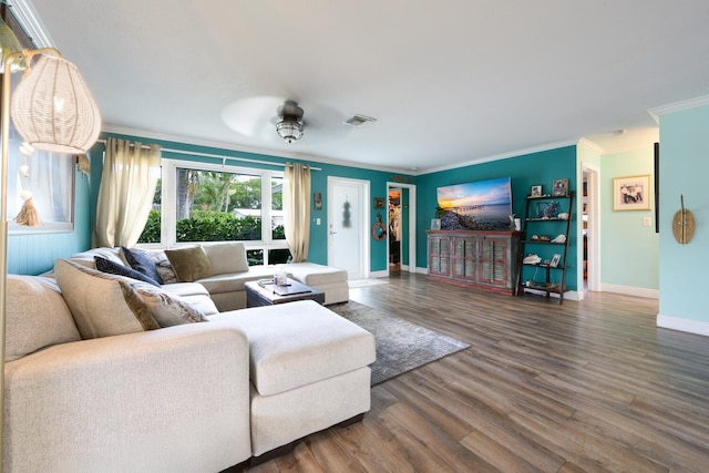 living room featuring wood-type flooring, crown molding, and ceiling fan