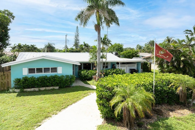 ranch-style house with a front lawn