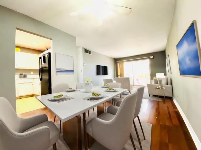 dining area featuring ceiling fan and hardwood / wood-style flooring