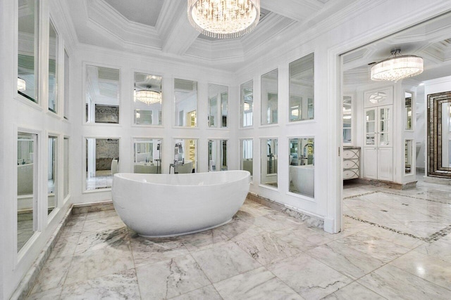 sunroom / solarium with a chandelier