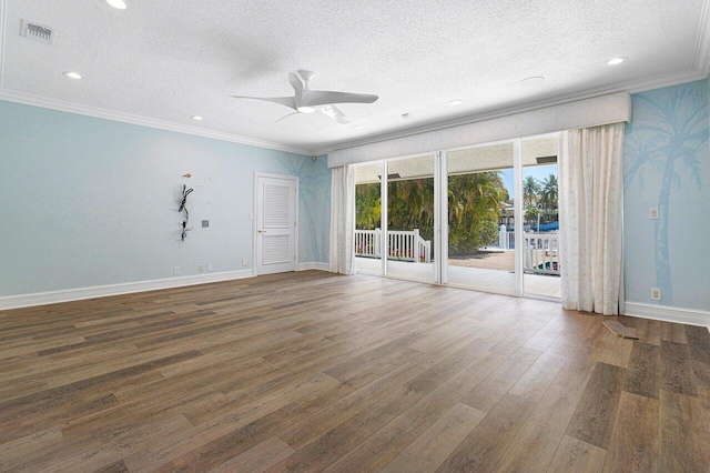 empty room featuring a textured ceiling, ceiling fan, and dark wood-type flooring