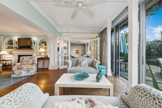 living room with plenty of natural light, ceiling fan, hardwood / wood-style floors, and ornamental molding