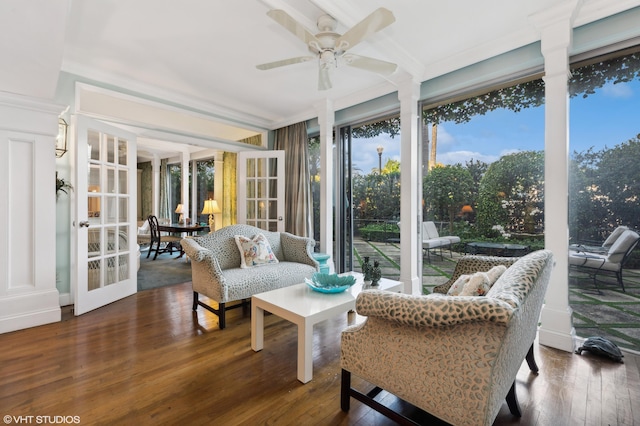 sunroom / solarium featuring french doors and ceiling fan