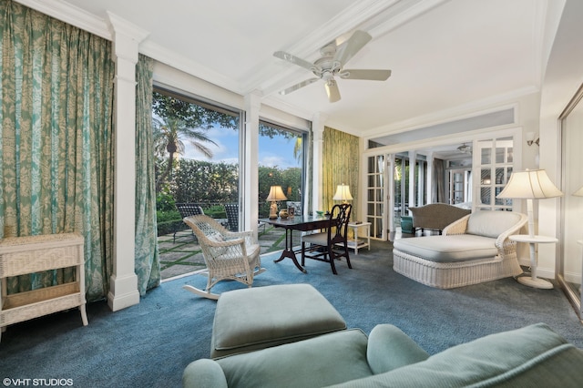 living room featuring ornamental molding, dark colored carpet, and ceiling fan